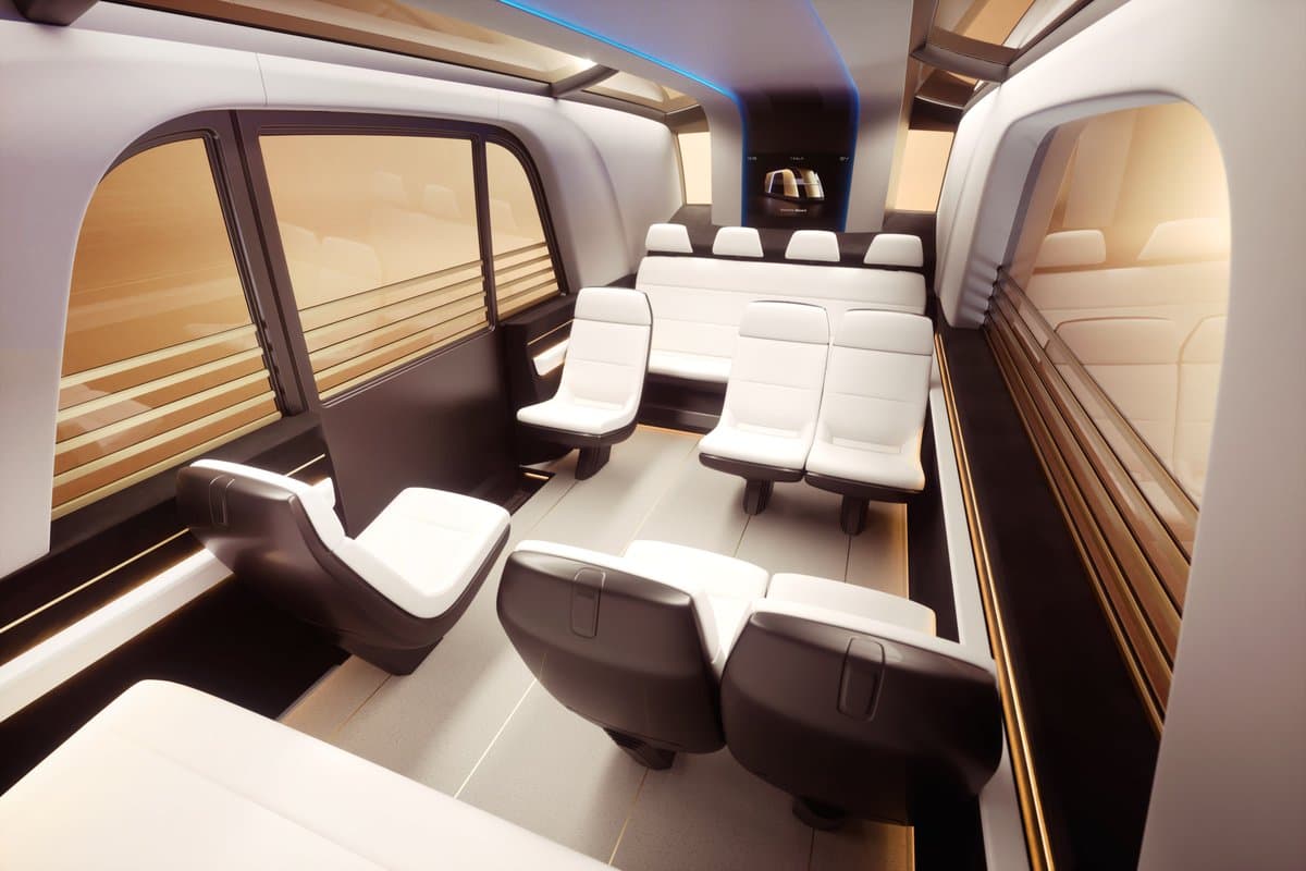 The Tesla Robovan features a futuristic design that combines aesthetics with functionality. This image showcases its spacious interior, ideal for both passengers and cargo.